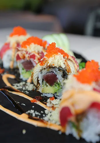 Japanese sushi rolls with tuna and spicy sauce