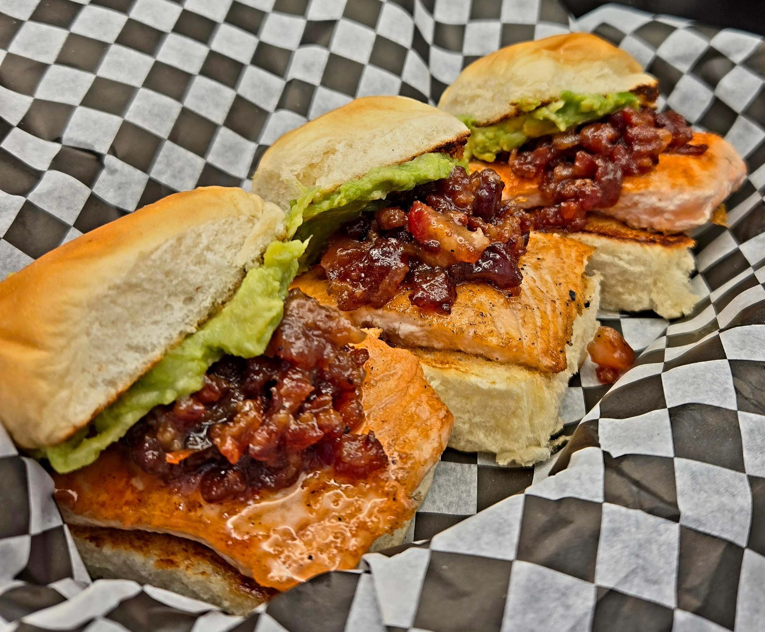 Delicious gourmet burger with fresh toppings on a wooden table