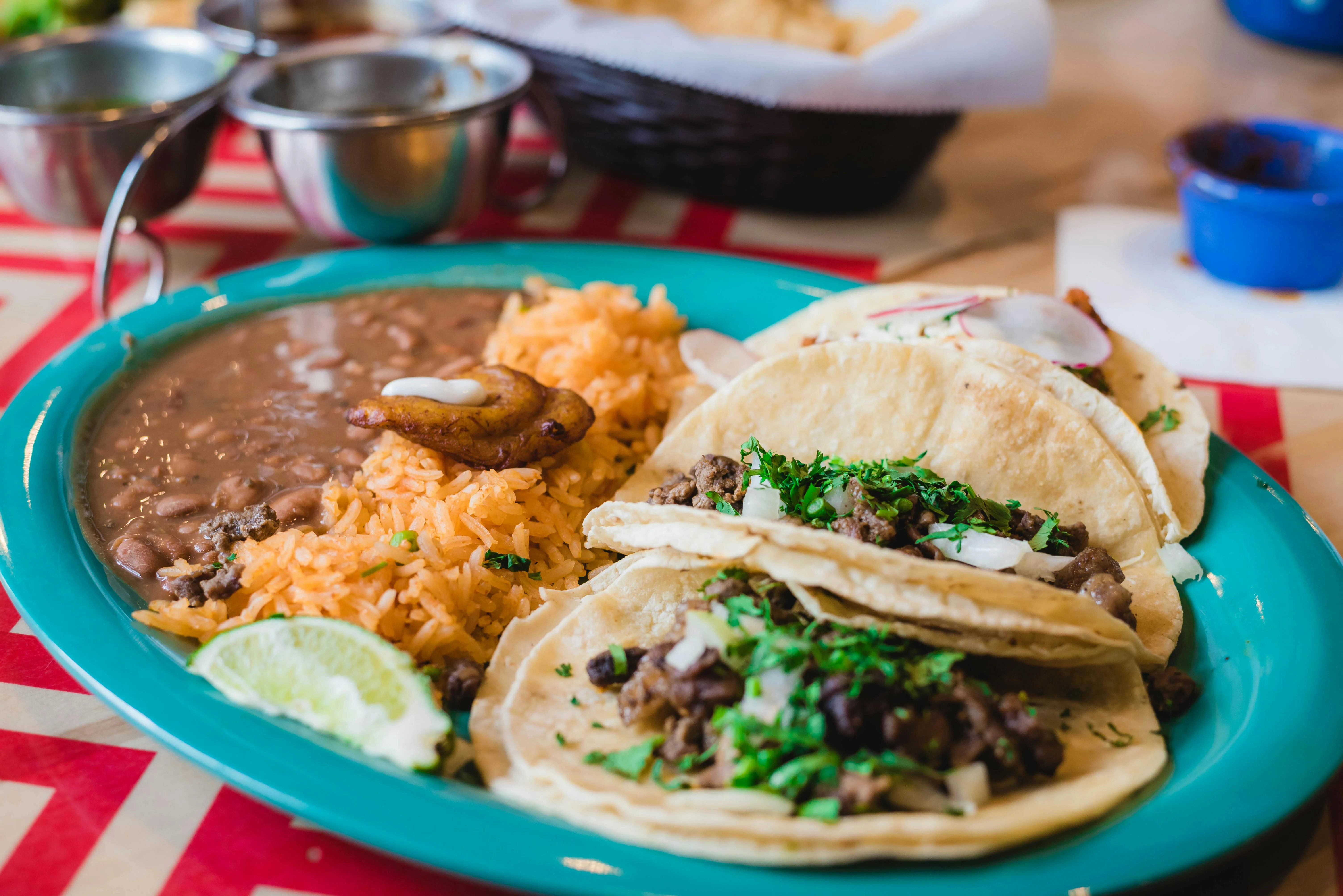 Authentic Mexican tacos with rice and beans