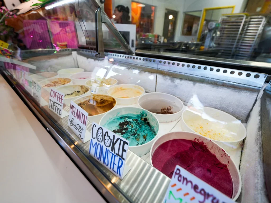 Colorful ice cream flavors in a vibrant ice cream shop