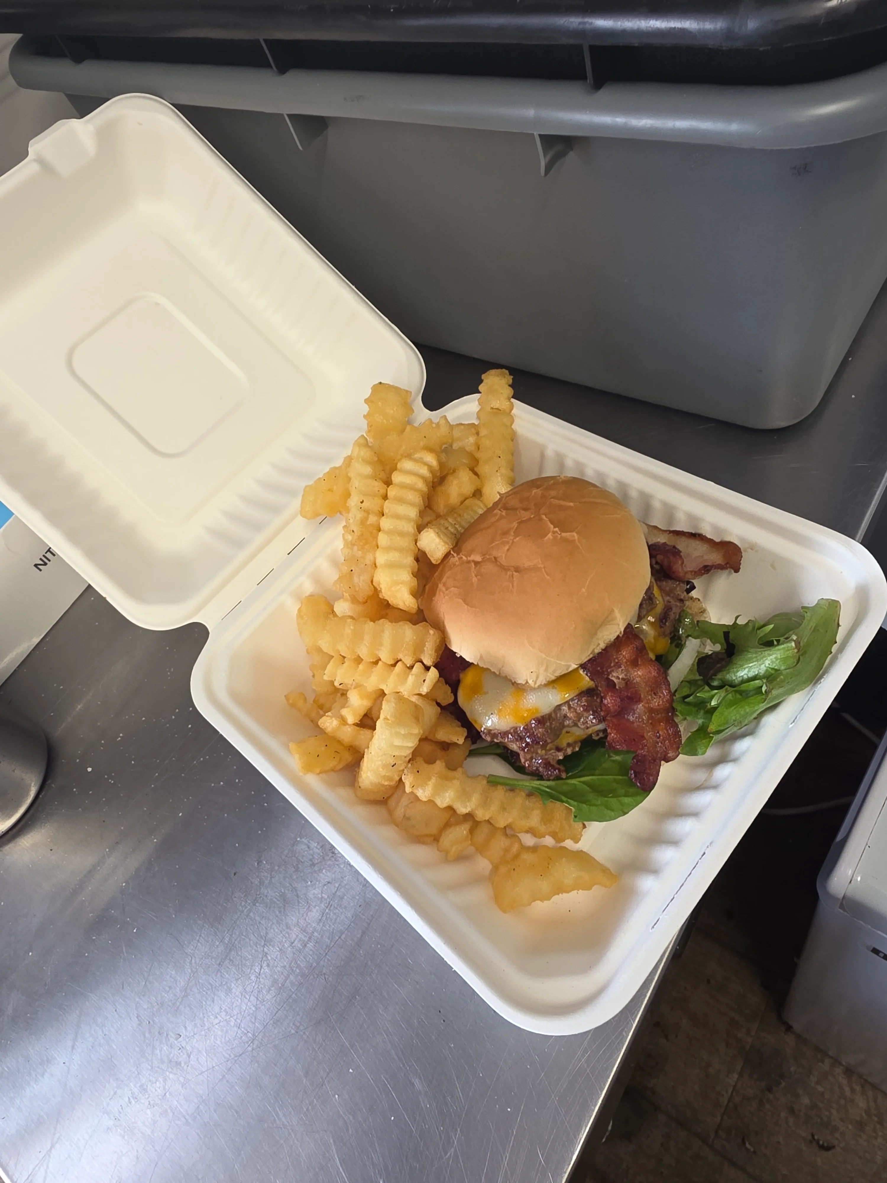Delicious gourmet burger with fresh toppings on a wooden table