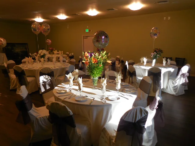 Elegant dining setup for a celebration with floral centerpiece