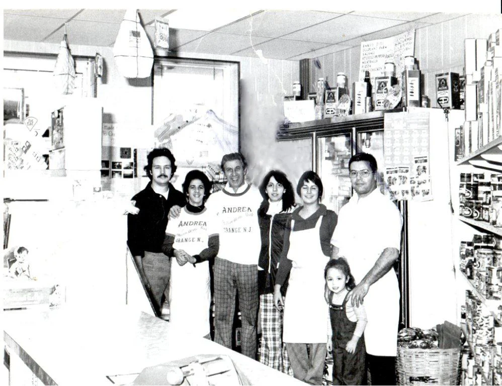 Historic family-run grocery store staff posing together