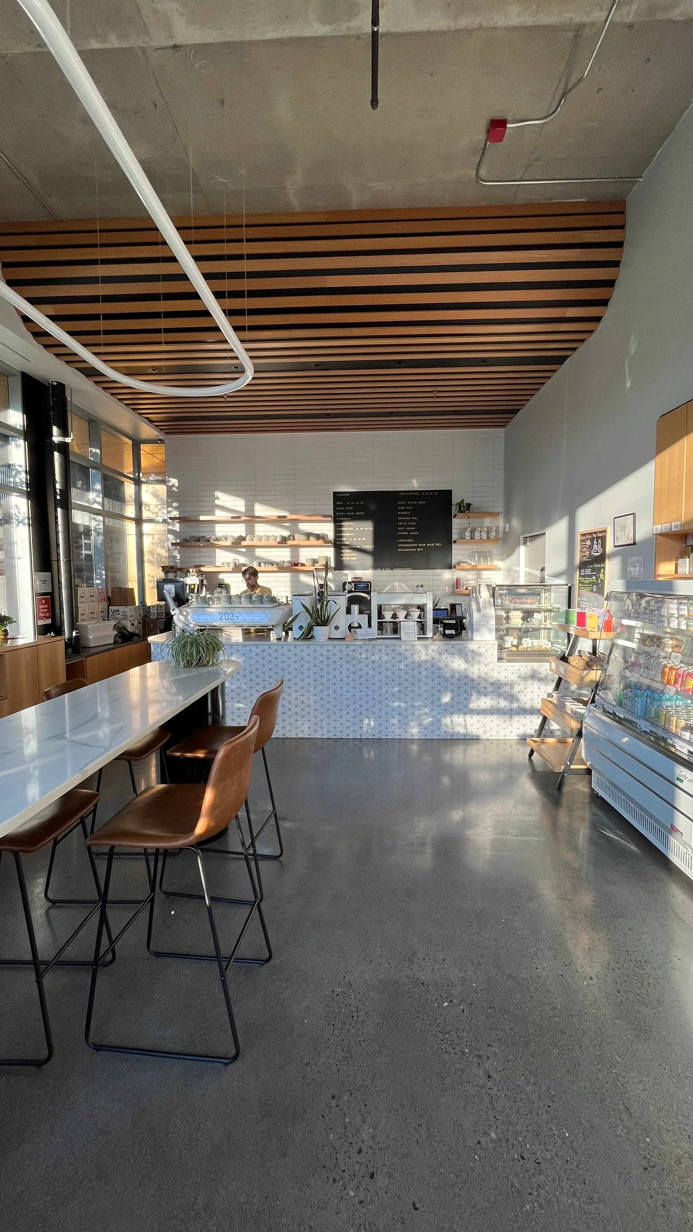 Modern café interior with stylish decor and counter