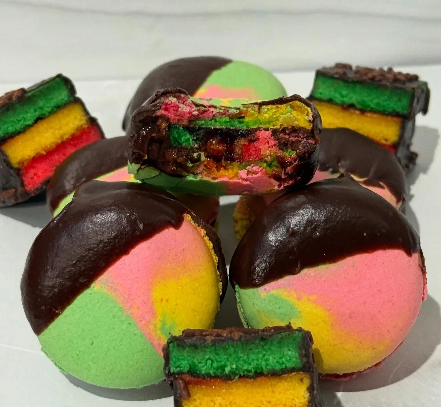 Colorful Jamaican rainbow cake with chocolate coating