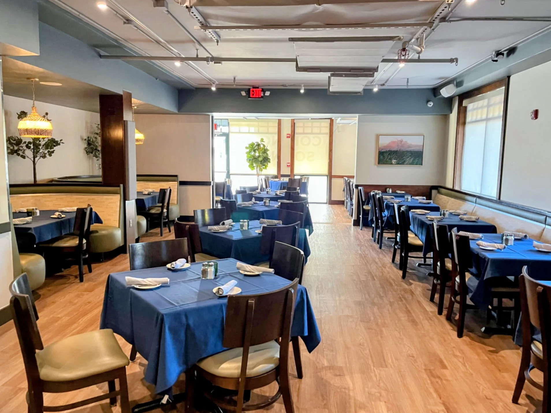 Cozy restaurant interior with blue tablecloths and warm lighting