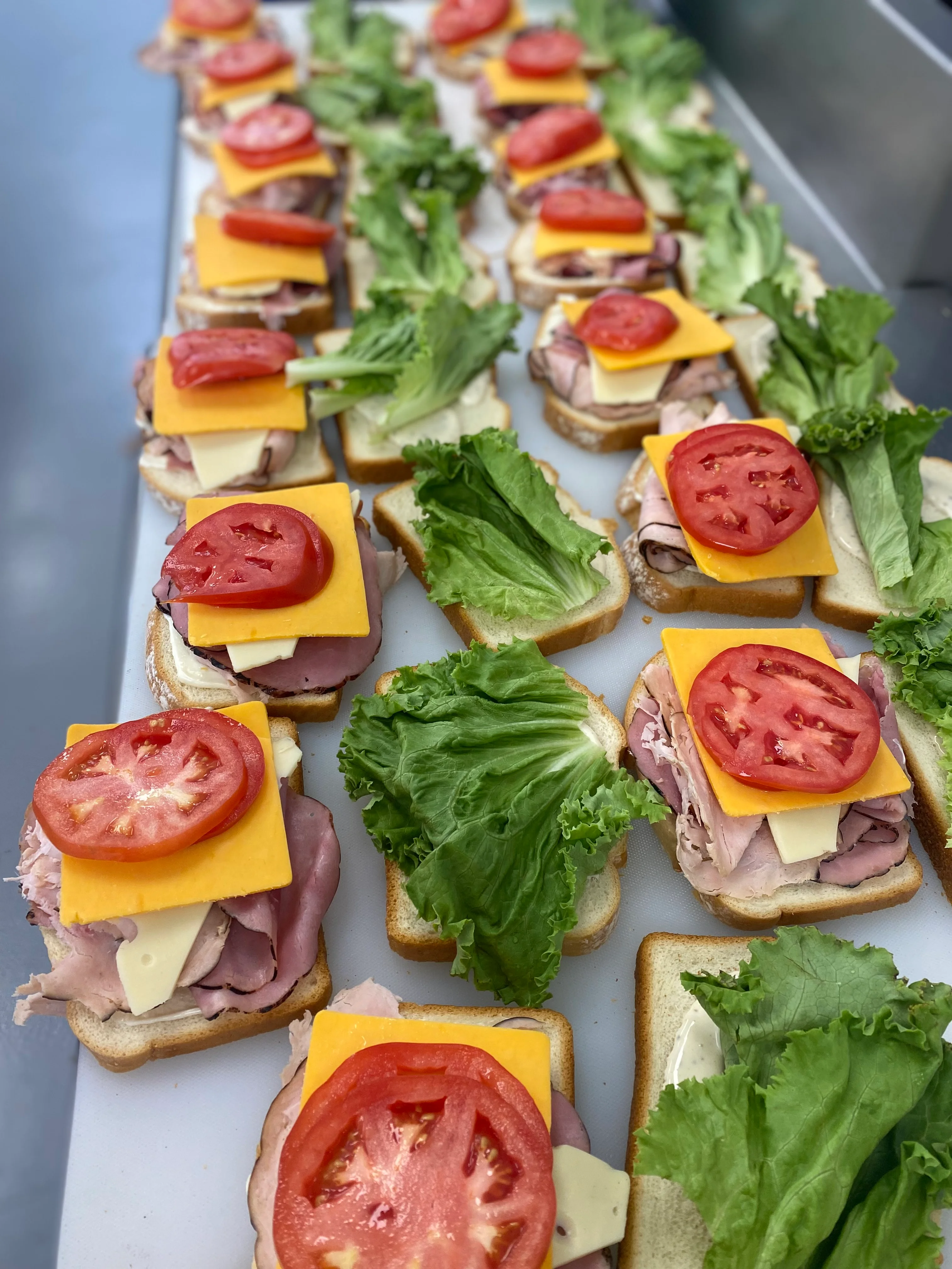 Classic deli sandwiches with layers of meat and fresh vegetables