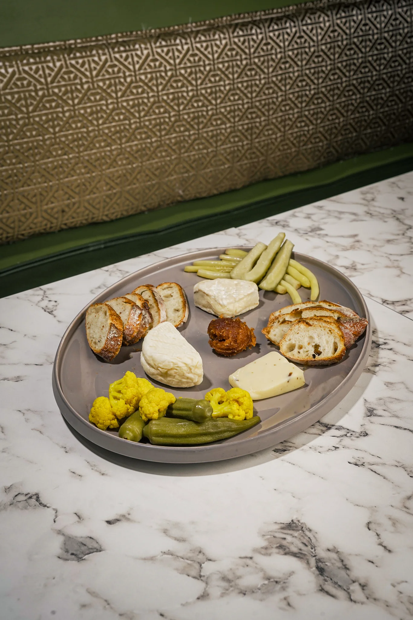Artisanal cheese platter with pickled vegetables