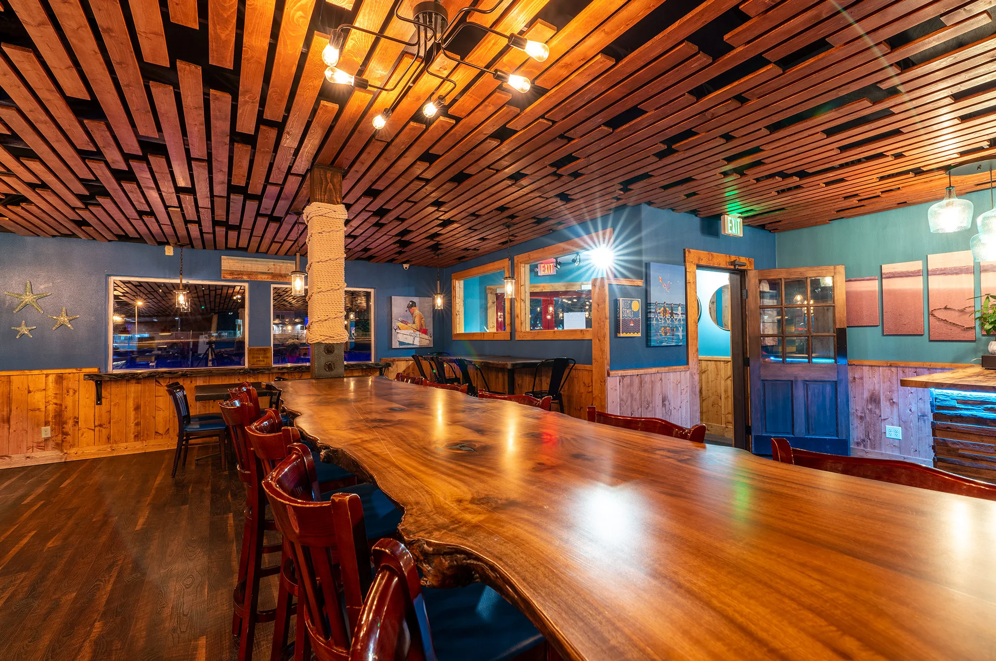 Cozy restaurant interior with wooden ceiling and bar seating