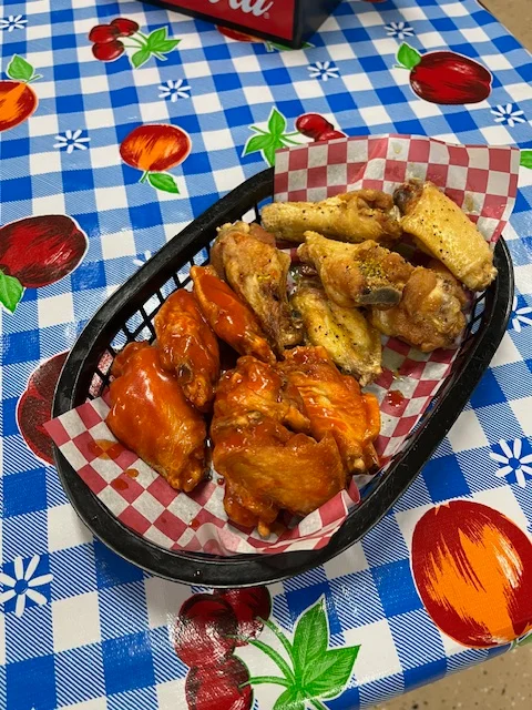 Plate of buffalo chicken wings with dipping sauce