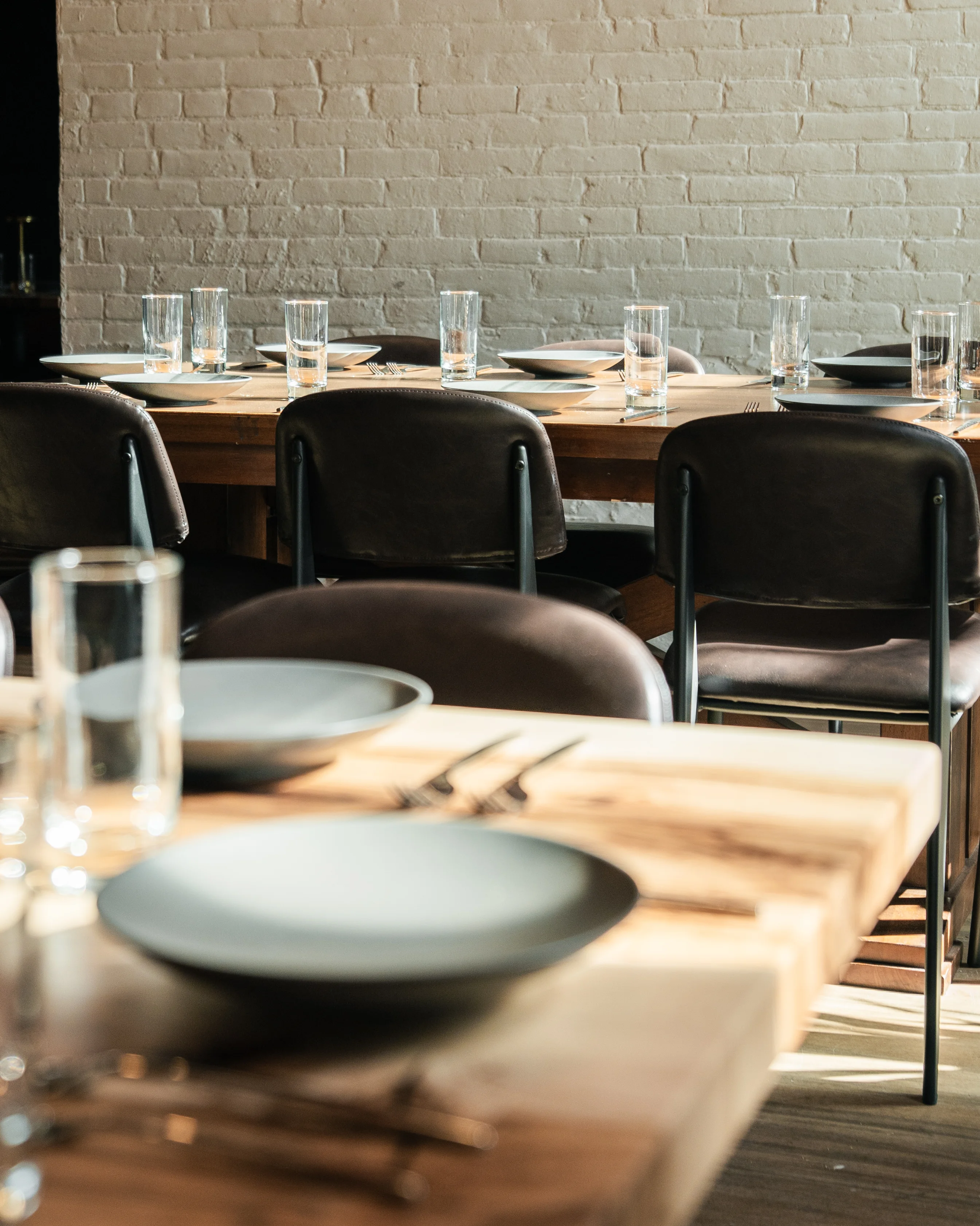 Cozy restaurant interior with wooden tables and modern chairs
