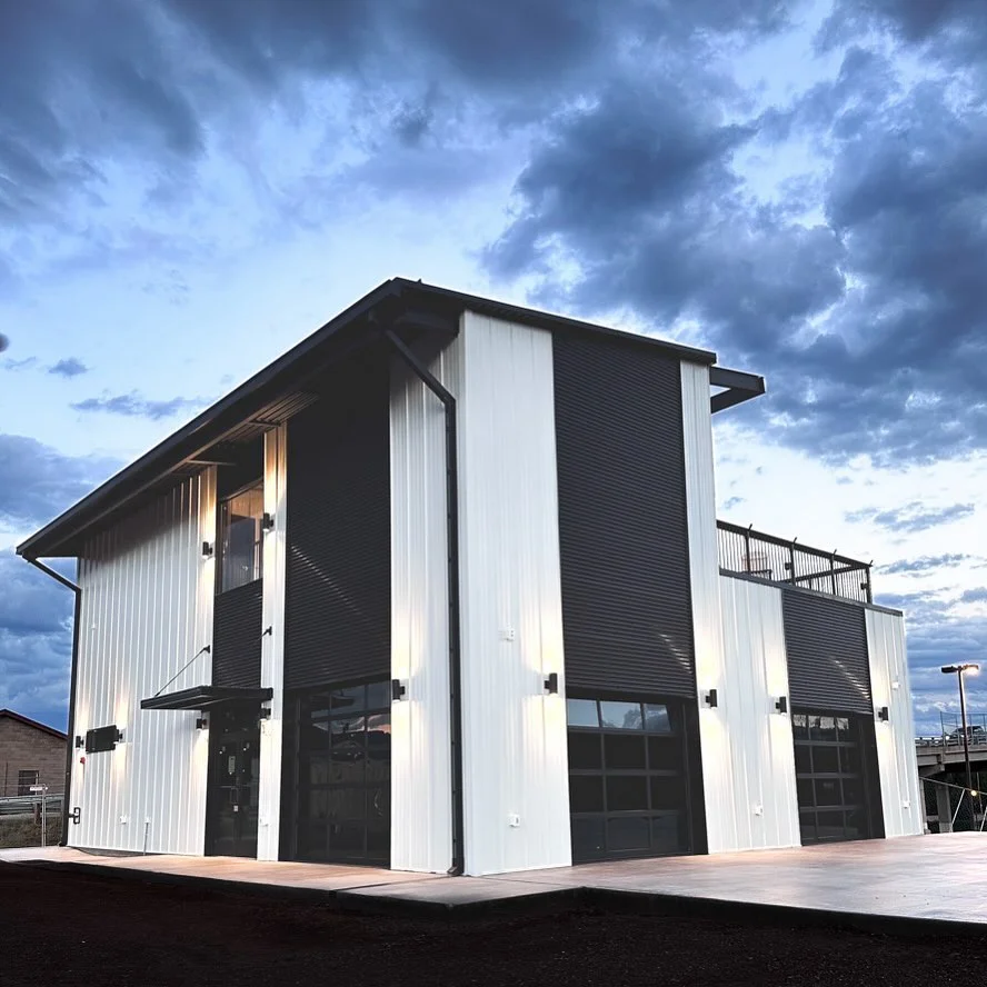 Modern restaurant exterior with sleek design and dramatic sky