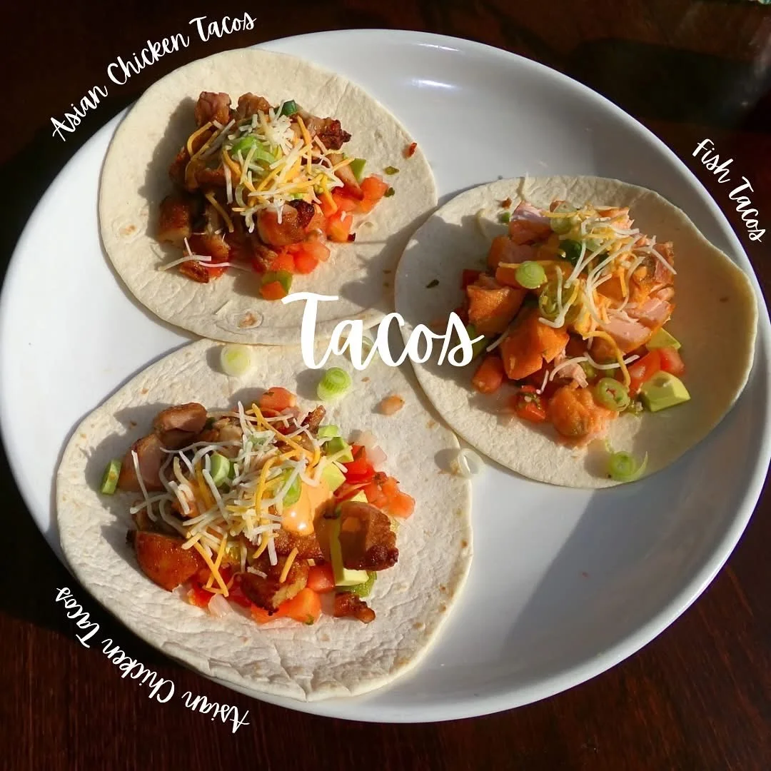 Assorted tacos featuring Asian chicken and fish varieties