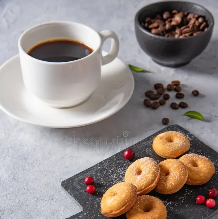 Freshly baked mini donuts served with coffee