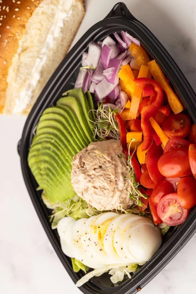 Fresh Mediterranean salad with tuna and avocado