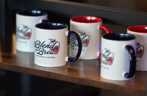 Red and blue mugs arranged on a wooden surface