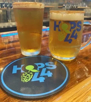 Craft beers served at Hops 44 bar with logo coasters