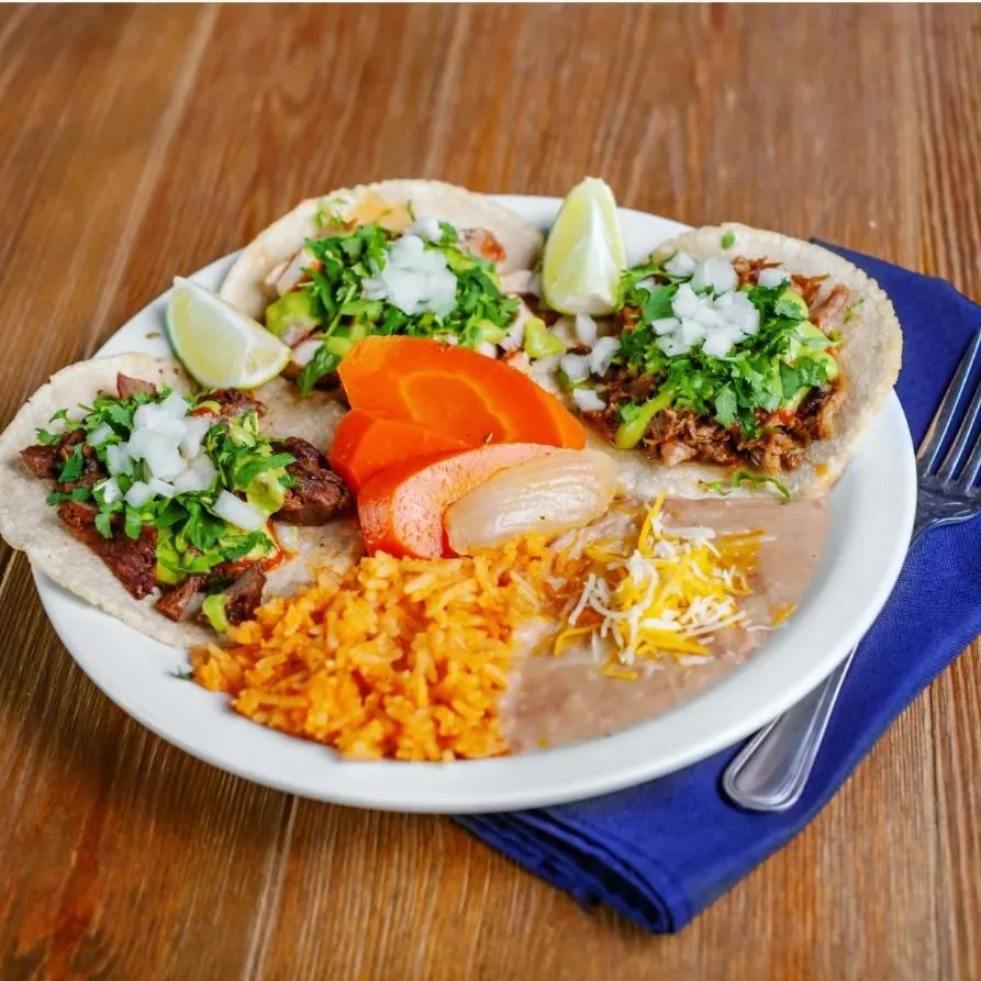 Authentic Mexican tacos with rice and beans
