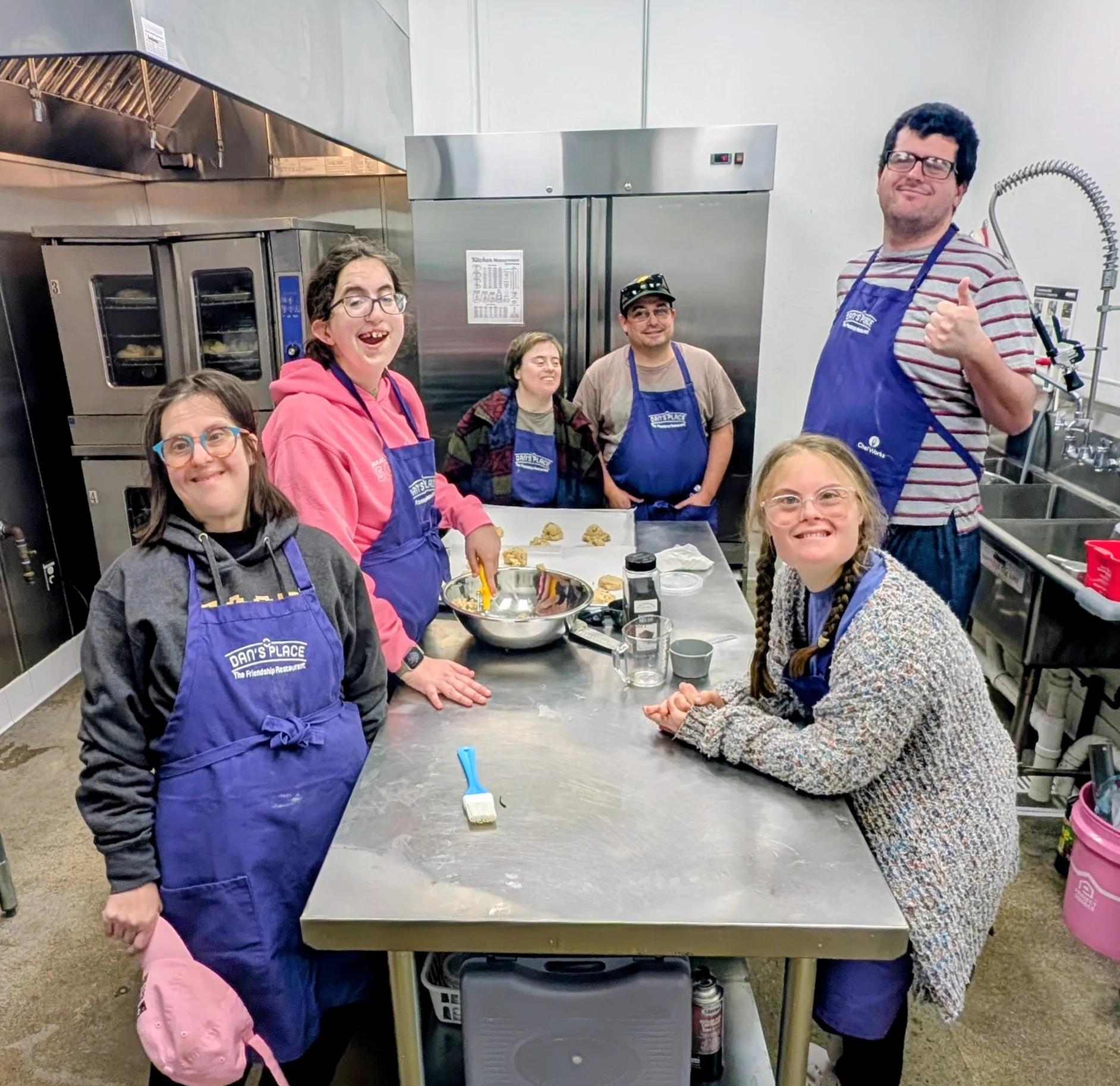 Group of chefs baking in a professional kitchen