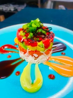 Colorful sushi tower with fresh vegetables