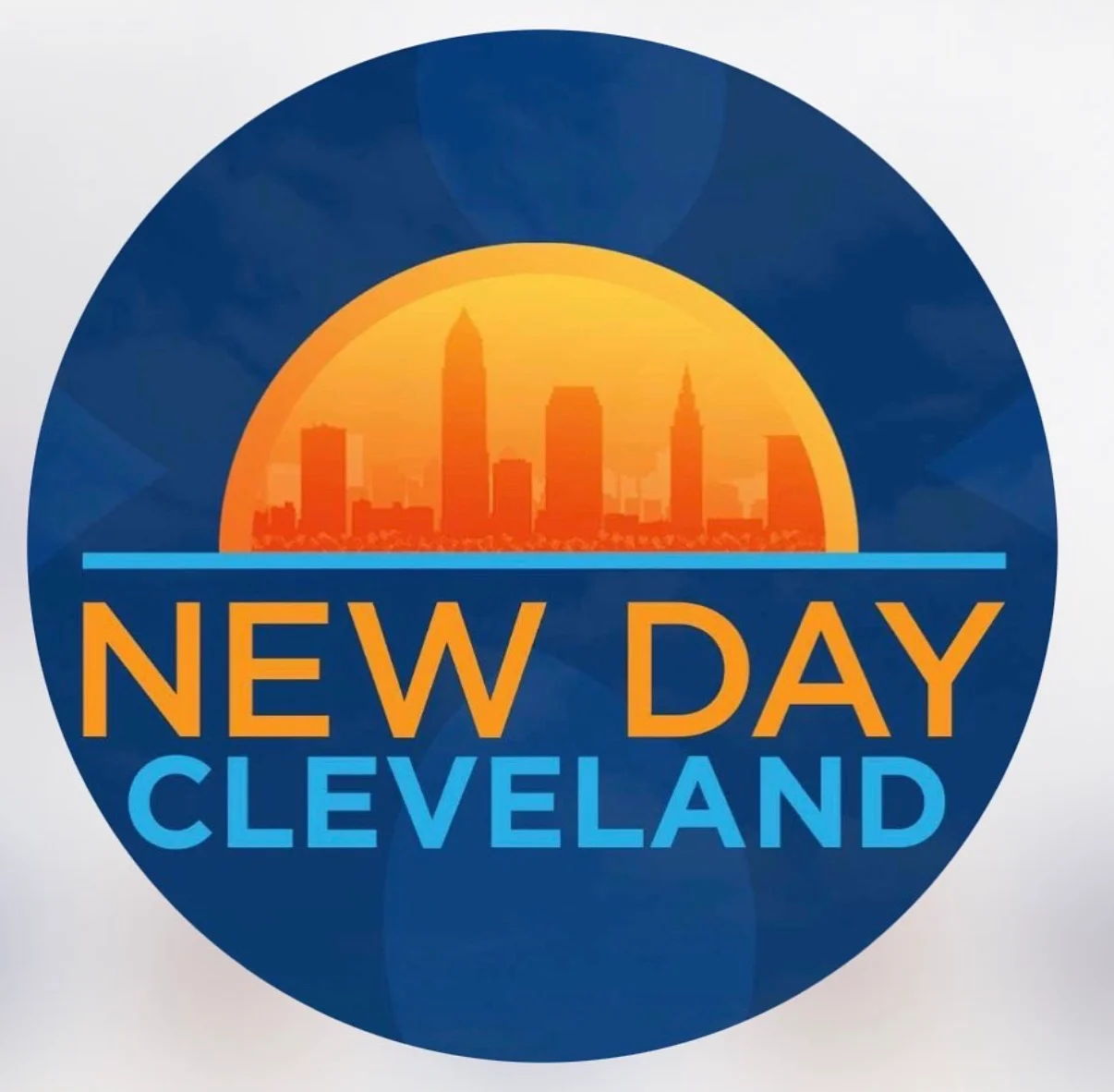 Logo of New Day Cleveland with skyline and sun design