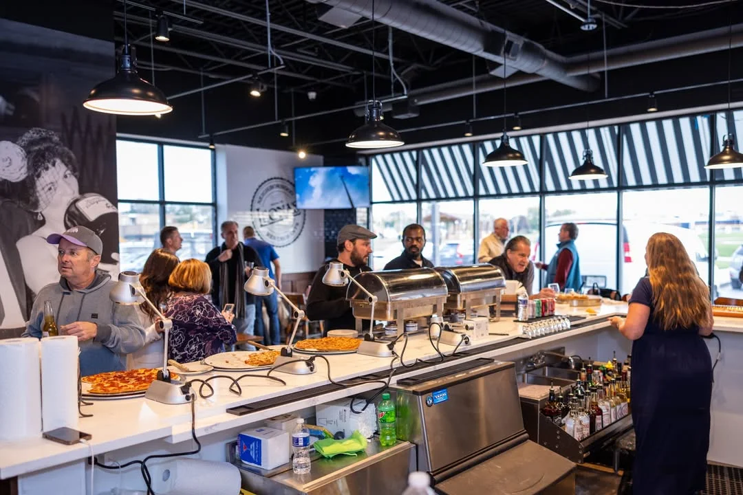 People eating inside a pizza pub
