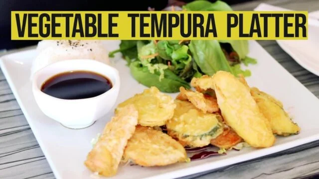 Japanese vegetable tempura platter with dipping sauce and salad