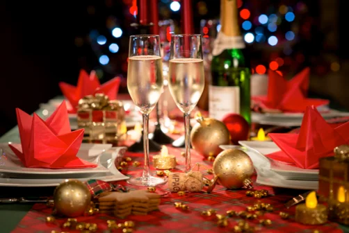 Festive holiday dining table with champagne and decorations