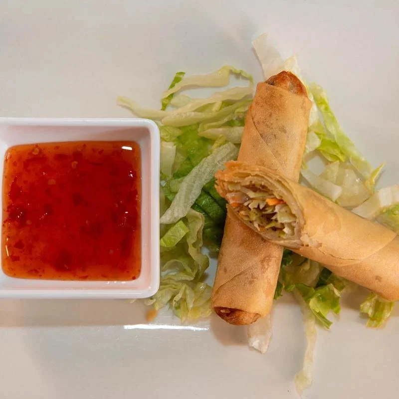Crispy Vietnamese spring rolls with sweet chili sauce