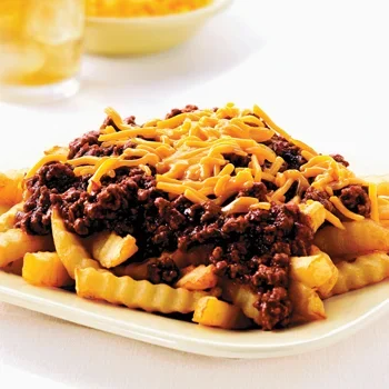 Delicious chili cheese fries topped with melted cheese and chili.