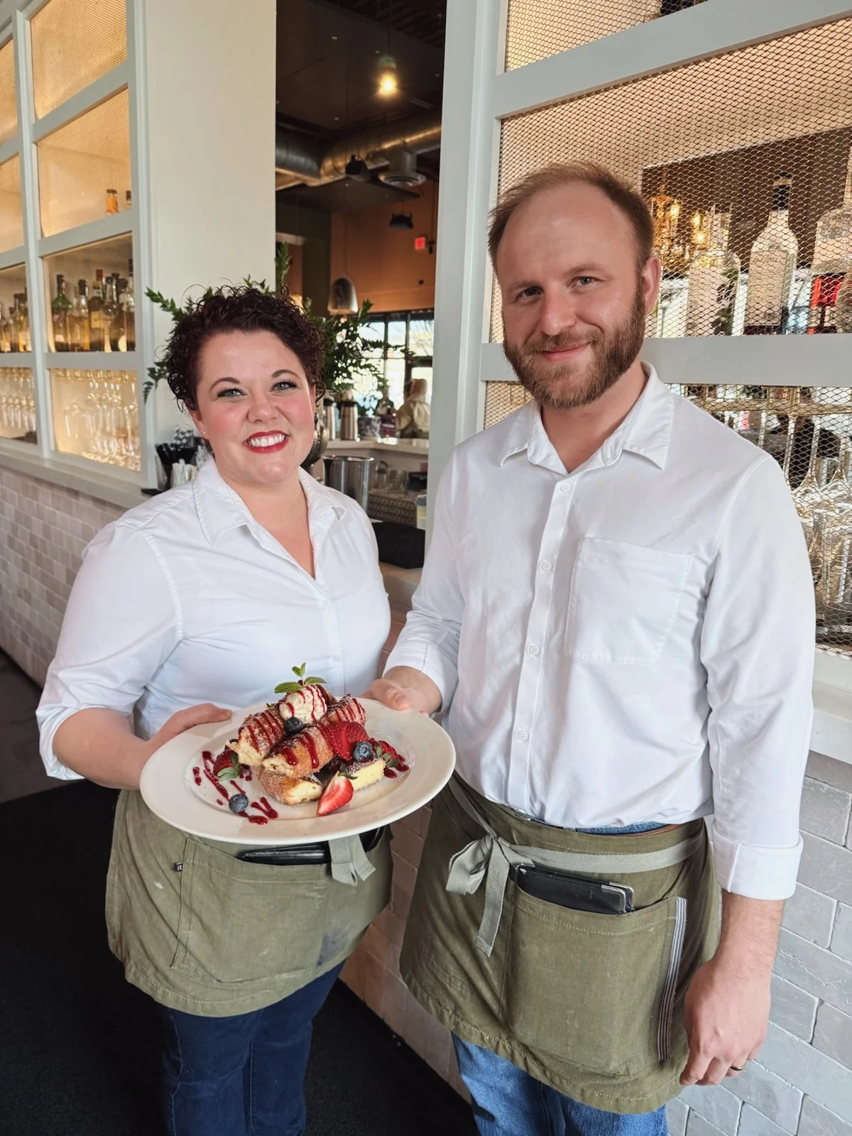 Delicious gourmet burger with fresh toppings on a wooden table