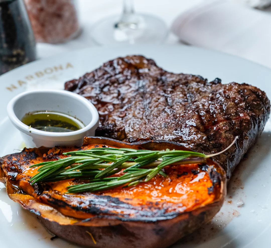Grilled steak with roasted sweet potato and red wine