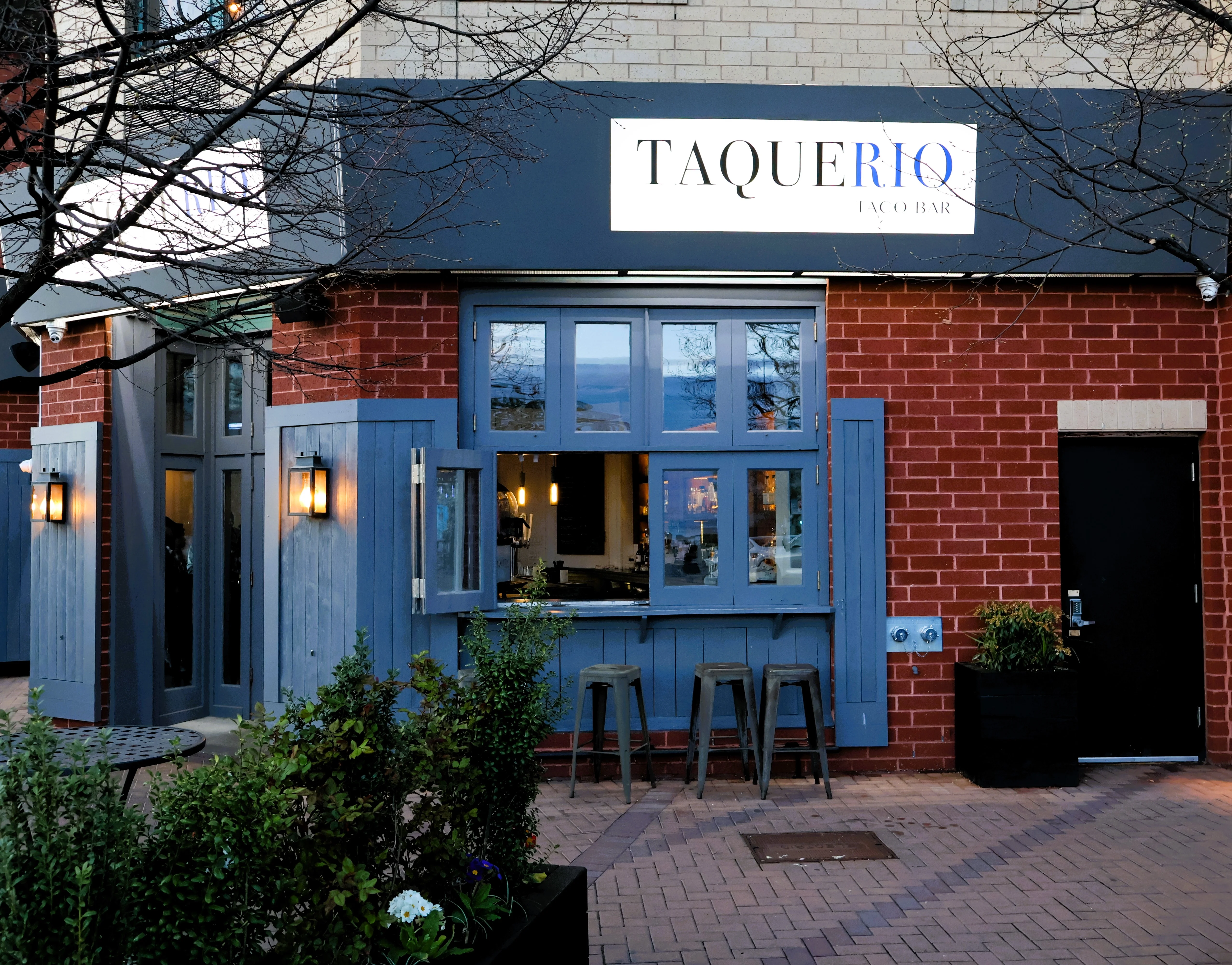 Exterior view of Taquerio Taco Bar with rustic charm