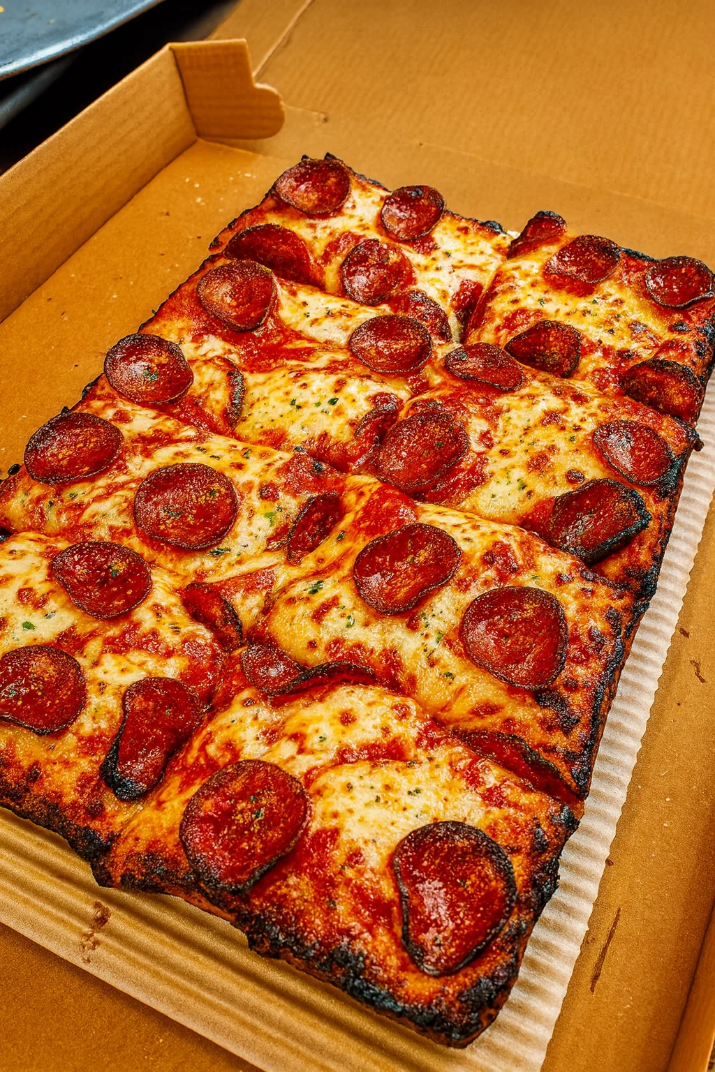 Pepperoni pizza in a classic rectangular box