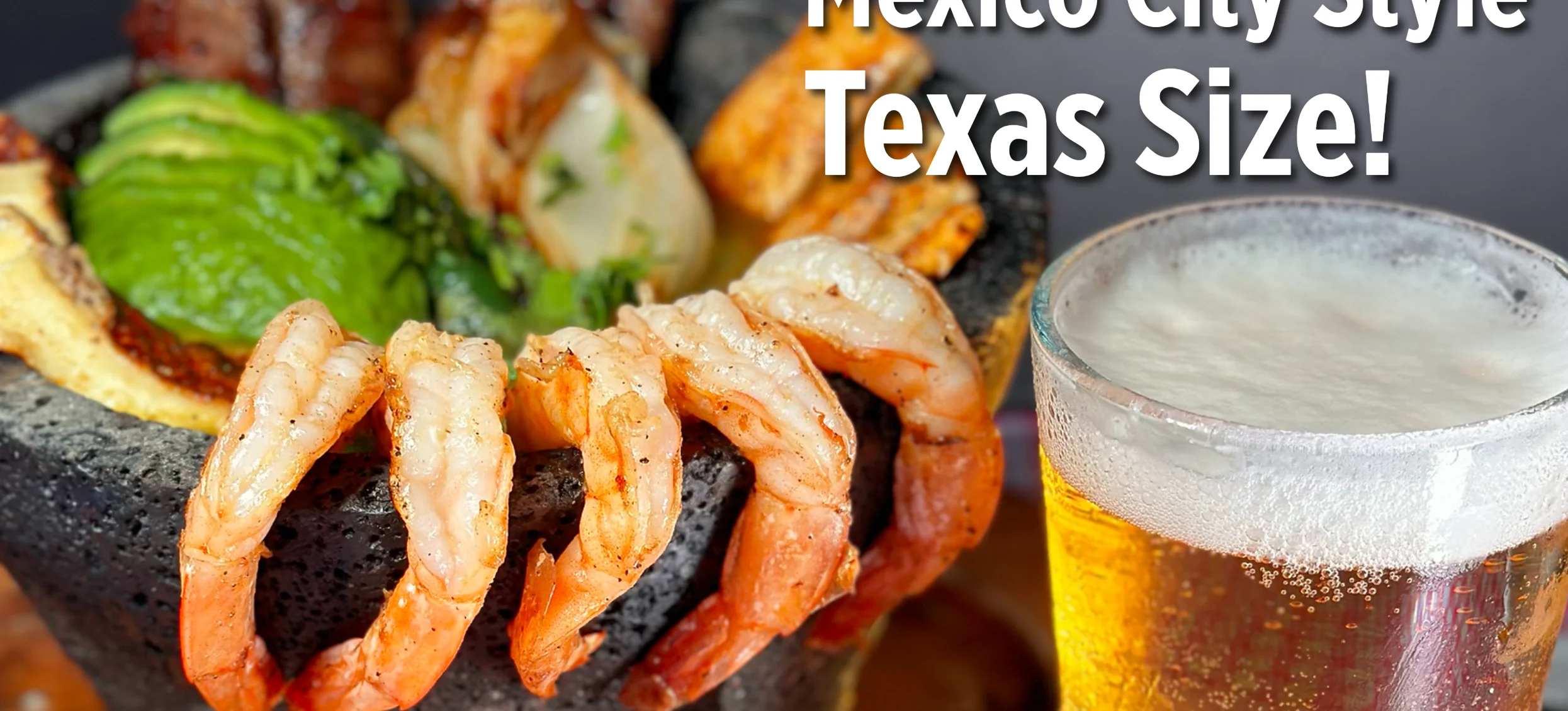 Mexico City-style Mexican platter with grilled shrimp, meats, avocado, and beer