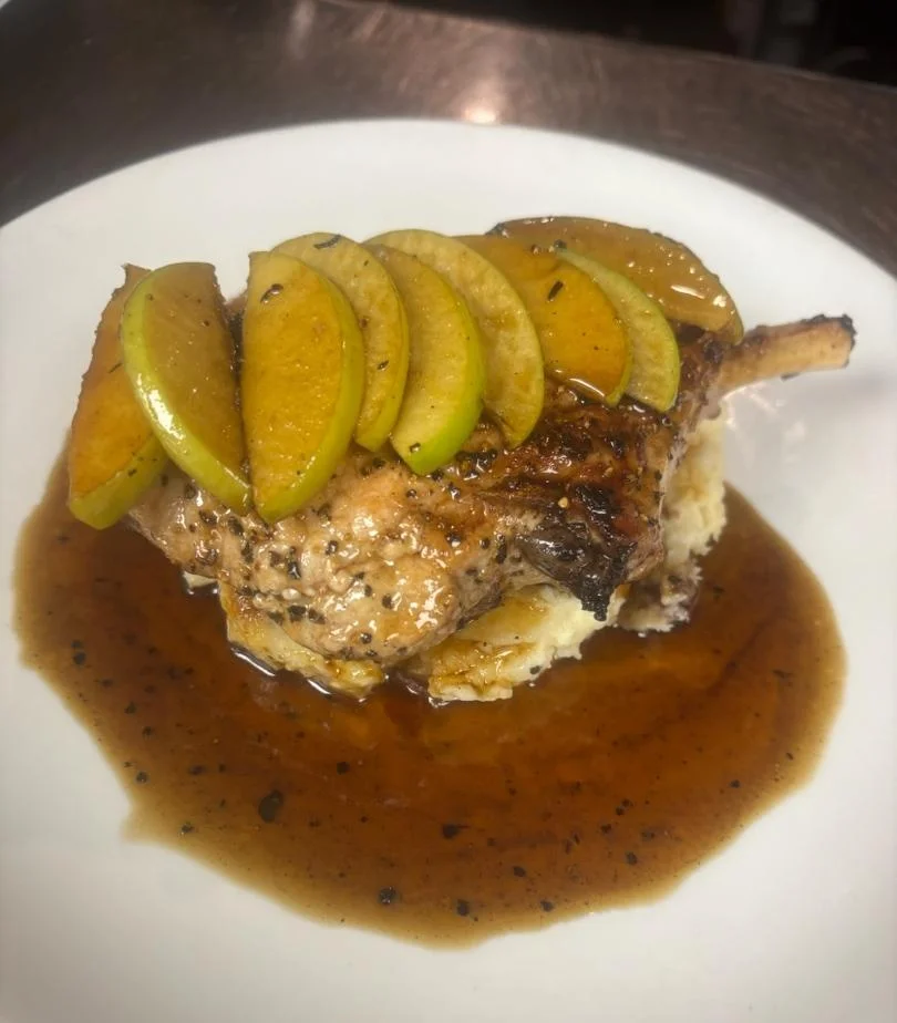 Savory apple-glazed pork chop with mashed potatoes