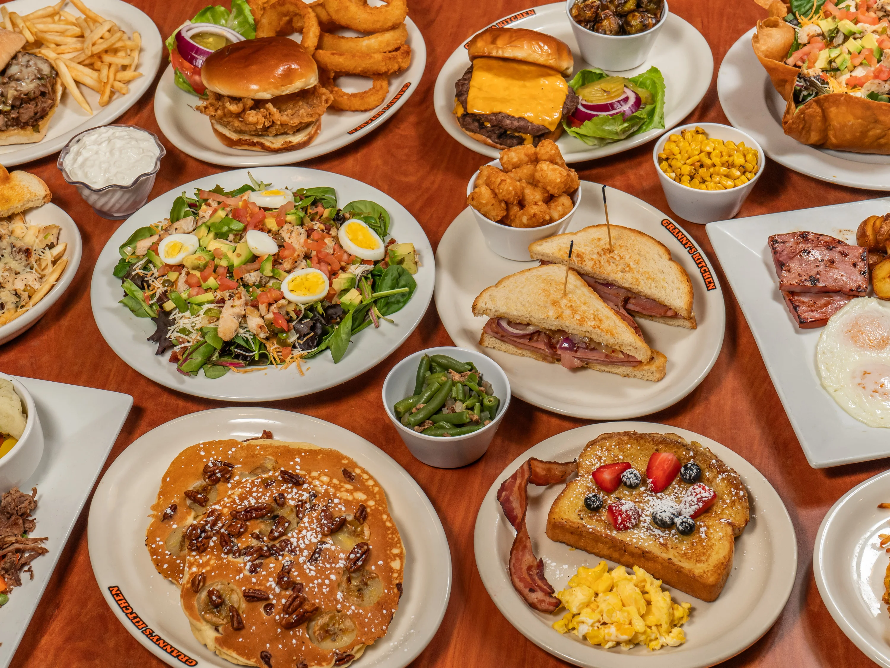 Variety of American comfort food dishes on a wooden table
