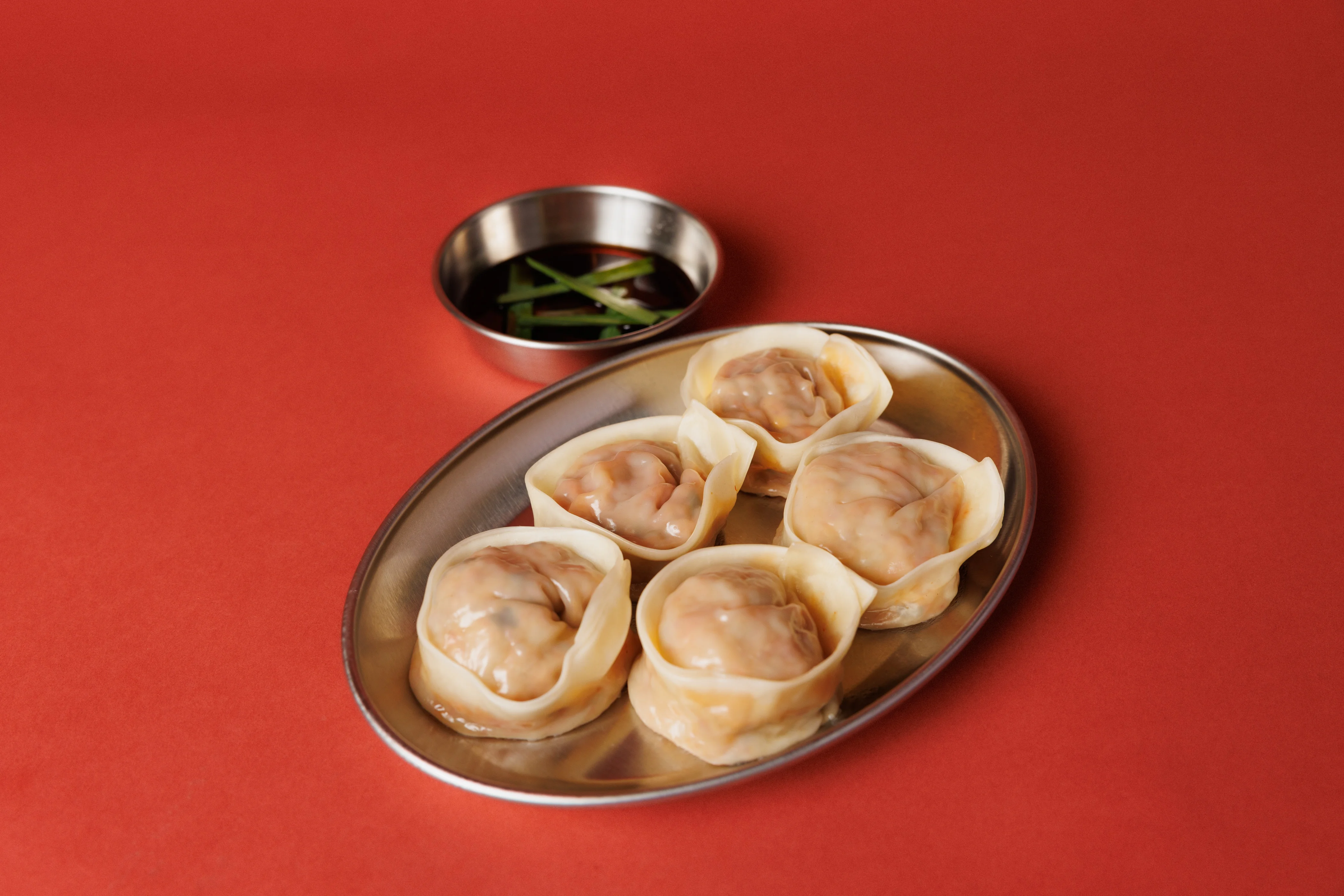Plate of Chinese dumplings with soy sauce