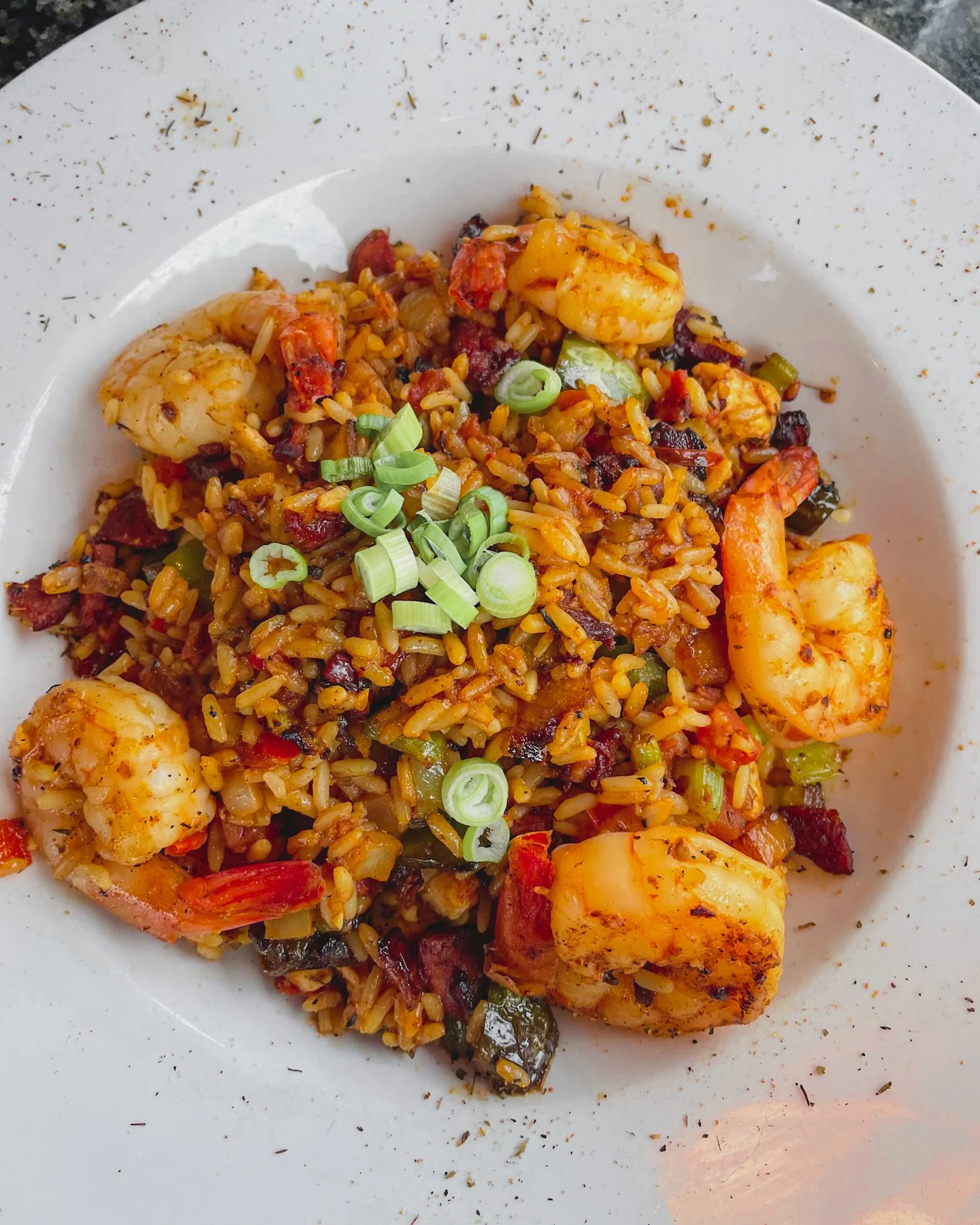 A colorful dish of food close-up, Jambalaya
