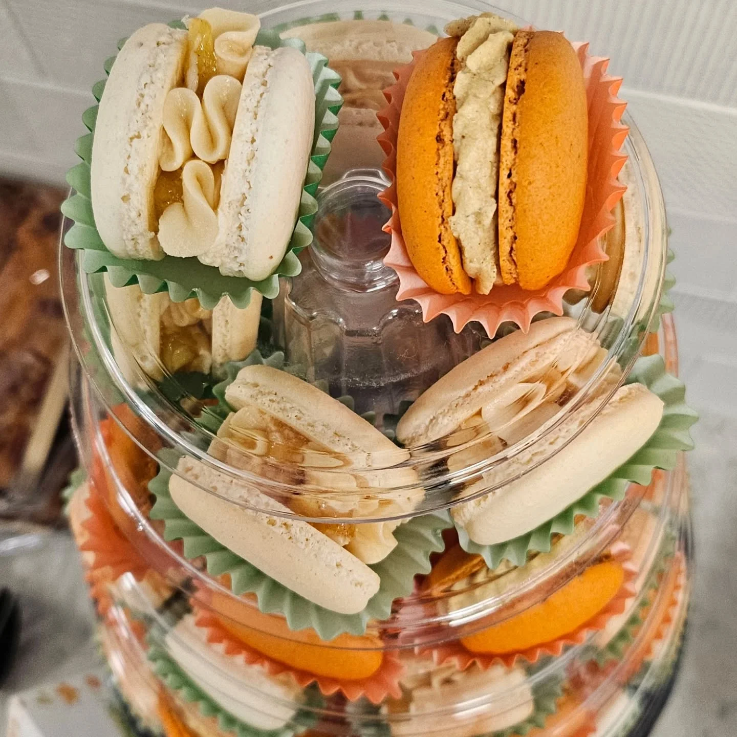 Colorful French macarons displayed in a tiered stand