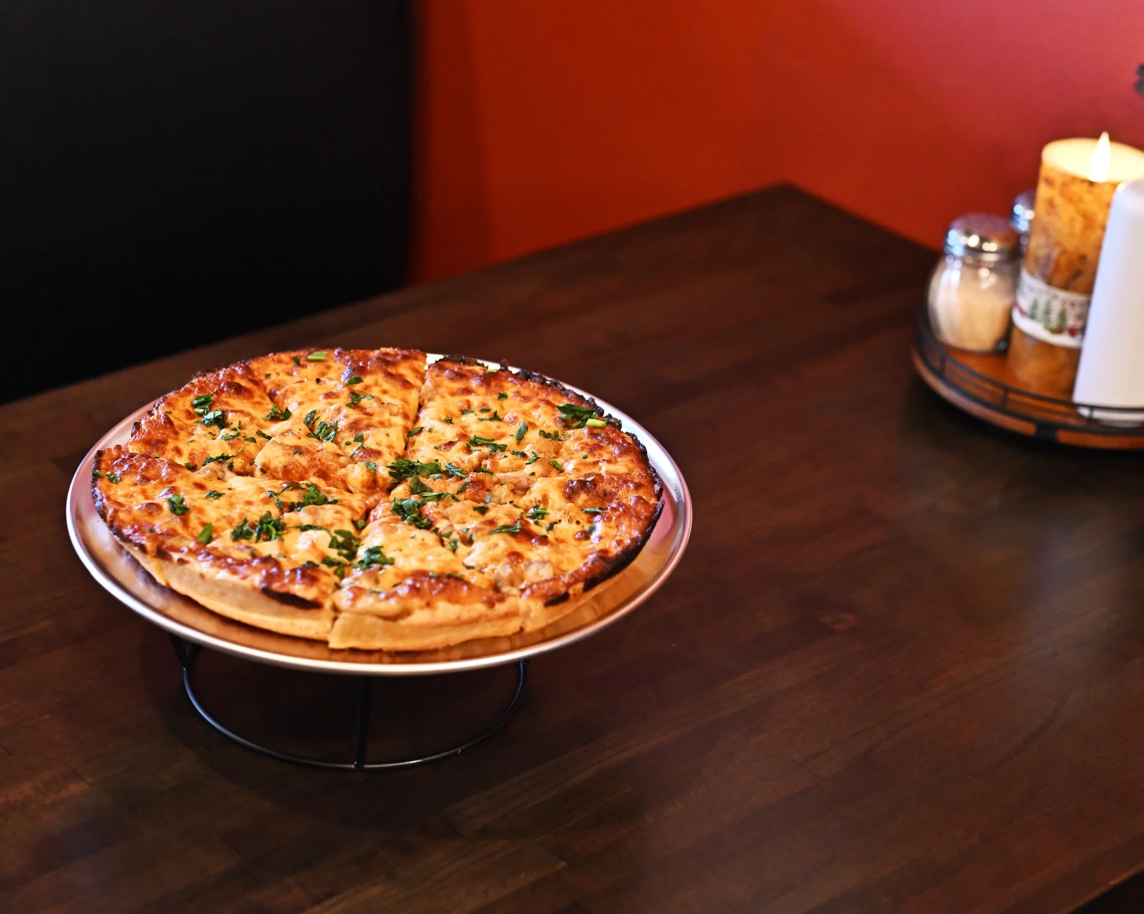 Delicious Margherita pizza on a wooden table