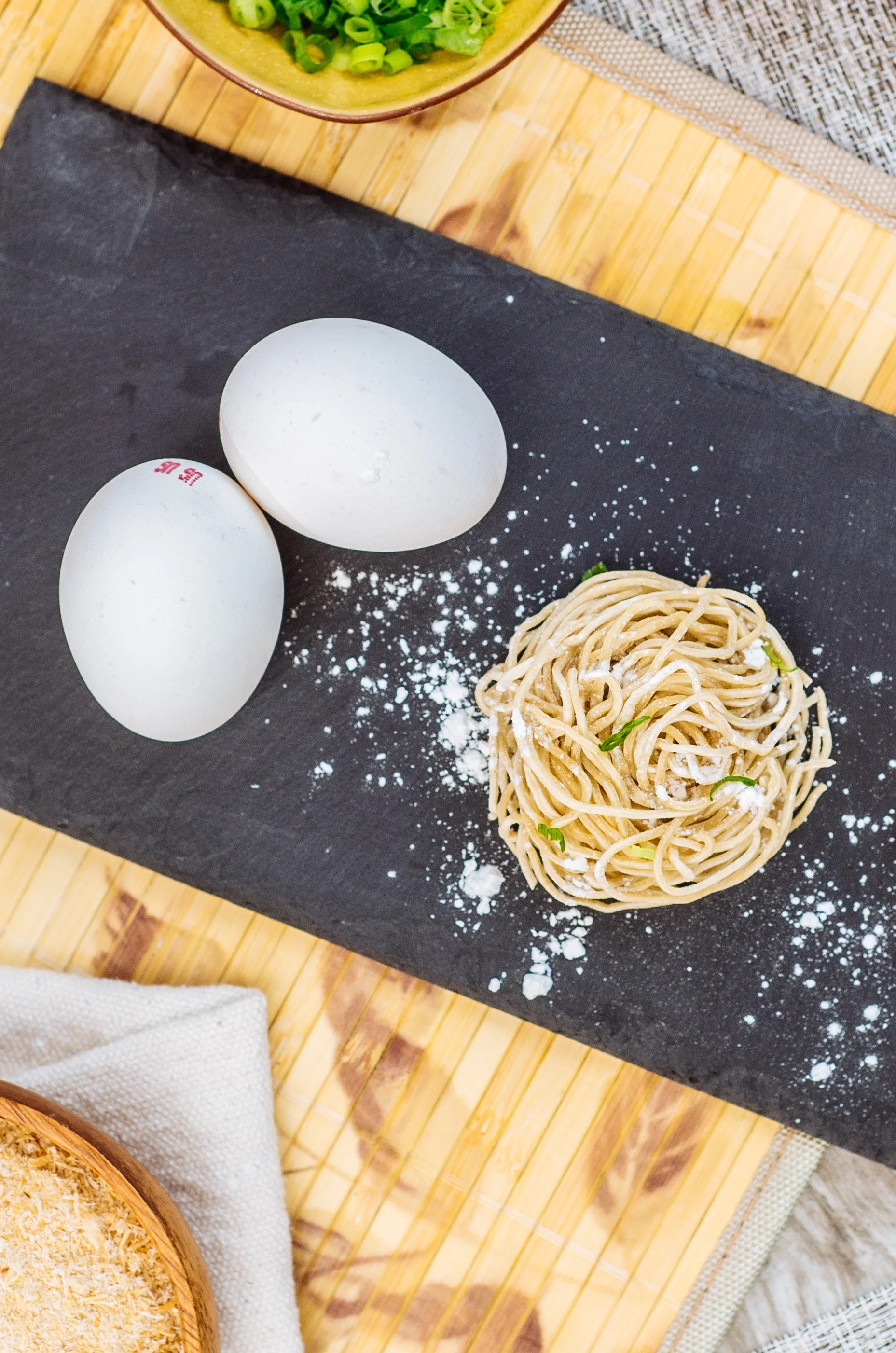 Ingredients for making Chinese noodles on a slate board