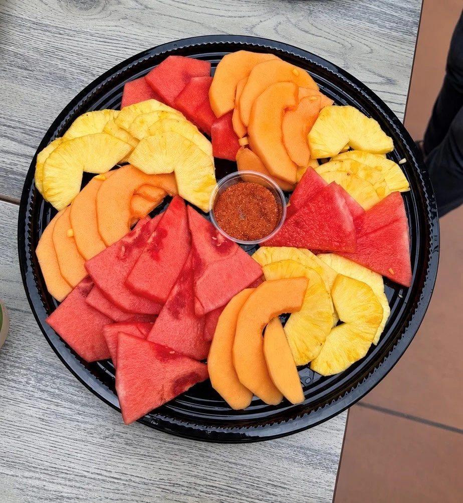 Colorful fruit platter with artistic floral designs