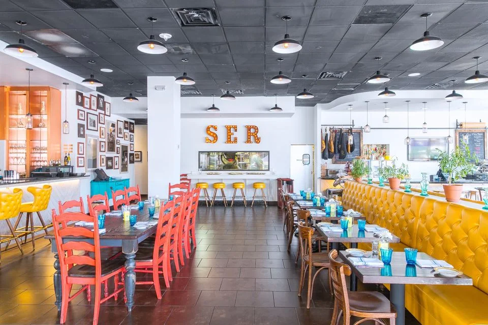 Vibrant restaurant interior with colorful seating and modern decor