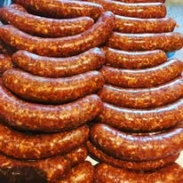 Cured Spanish chorizo sausages stacked neatly