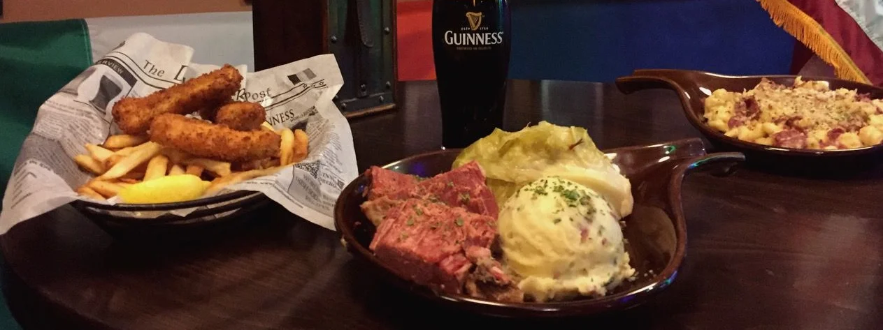 Irish corned beef and cabbage with Guinness in a cozy pub setting