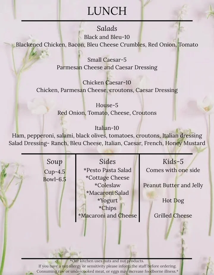 A lunch menu listing different salad options, soups, and sides available.