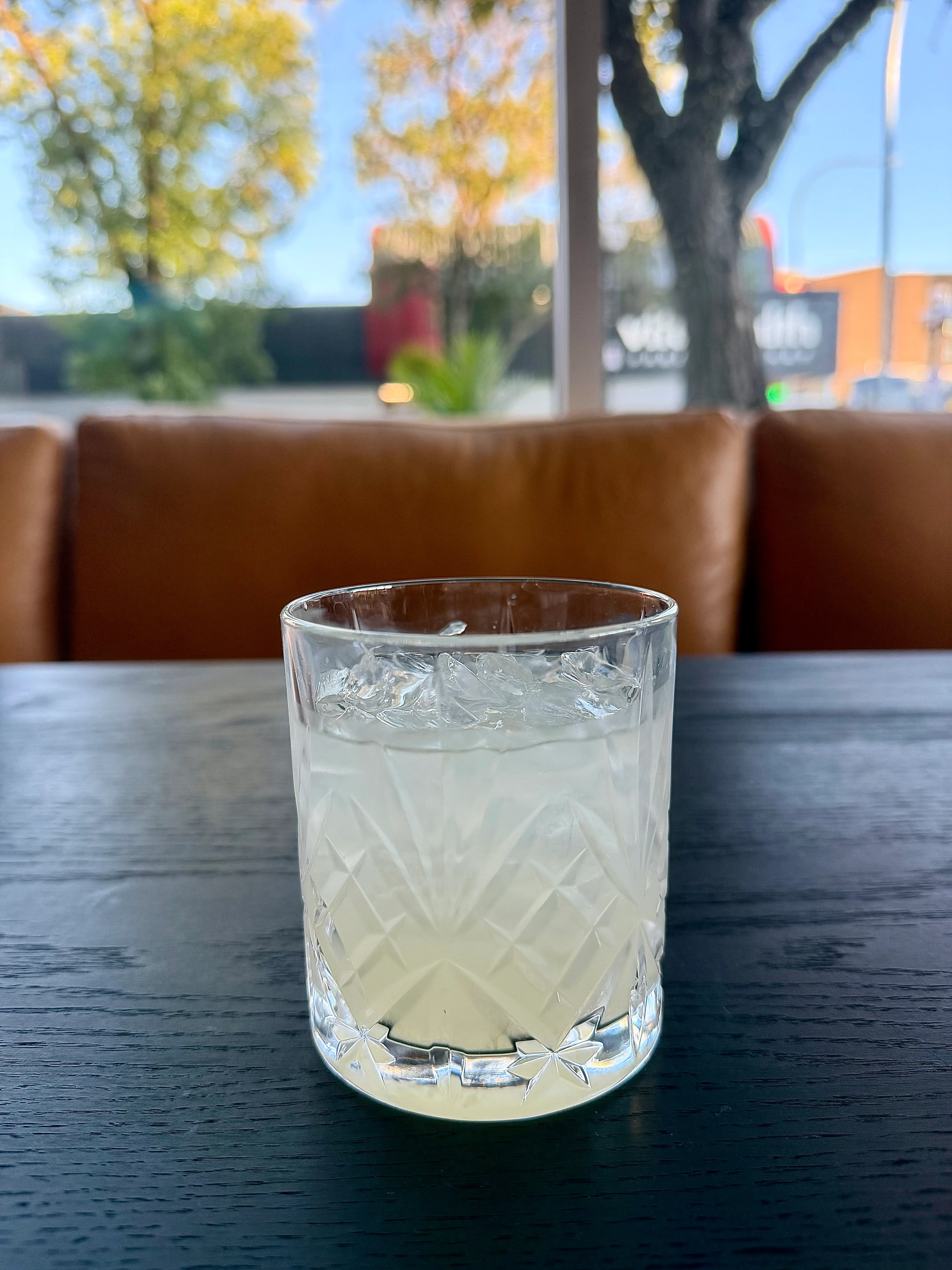 Refreshing cocktail served in a crystal glass with ice