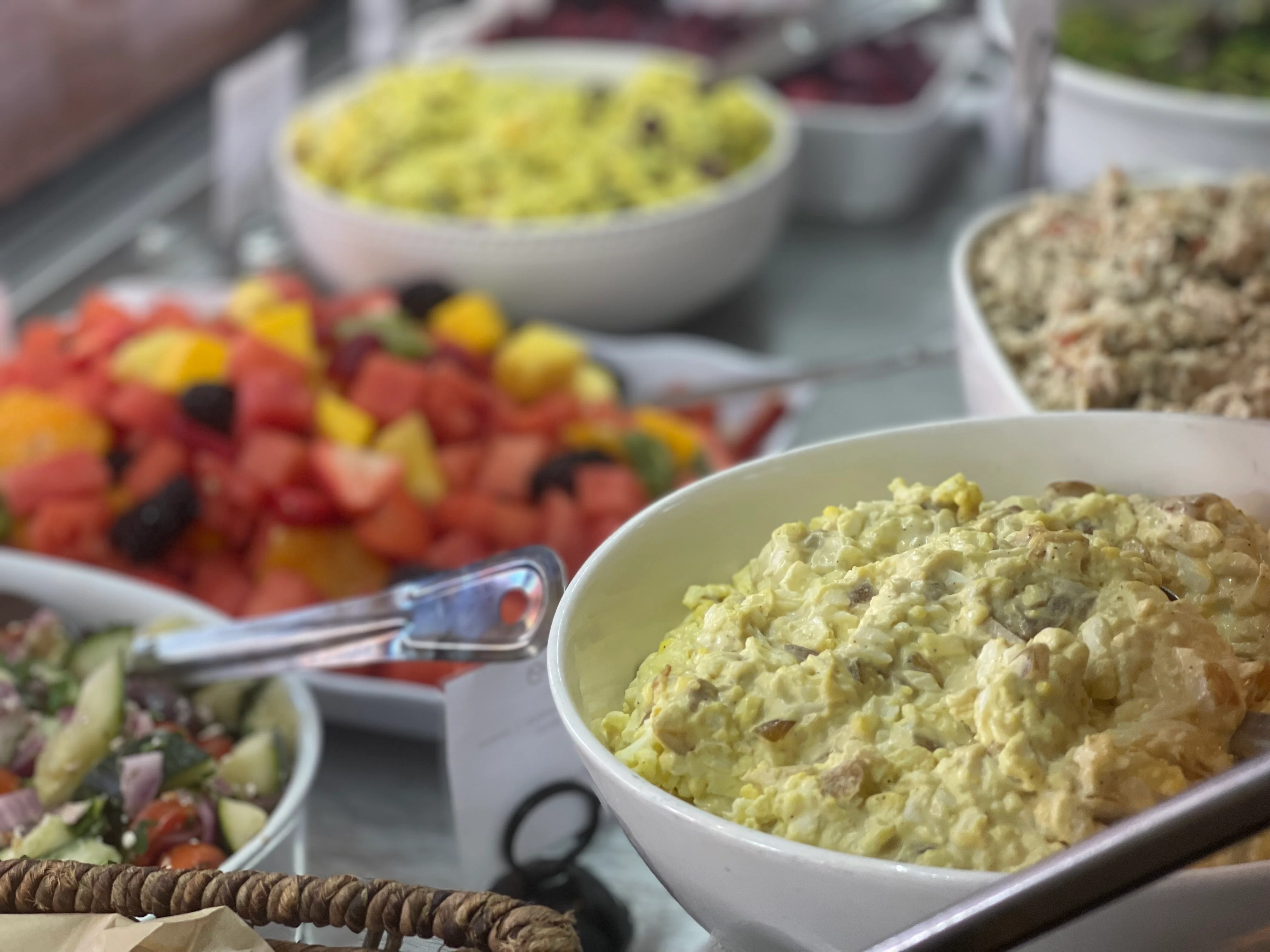 Colorful Mediterranean salad spread with various dishes