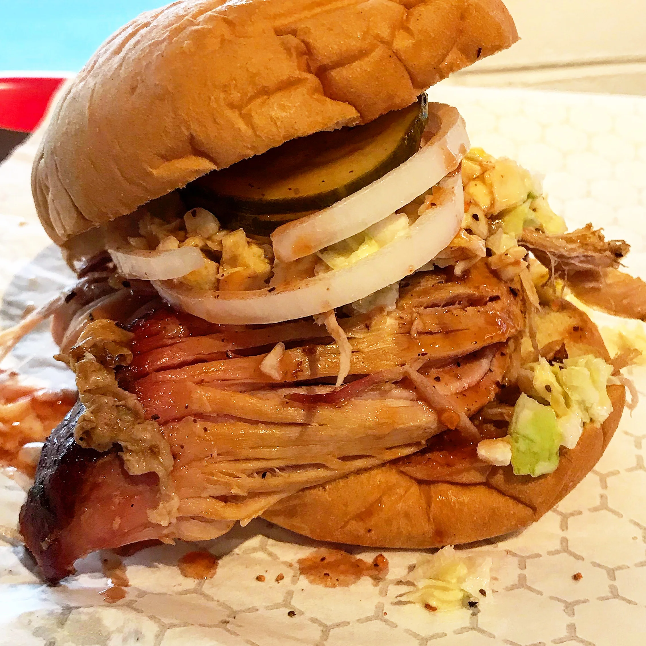 Delicious burger with toppings served on a wooden table